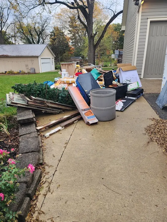 Dumpster being loaded with debris for 10 Yard Dumpster Rental in Plainfield